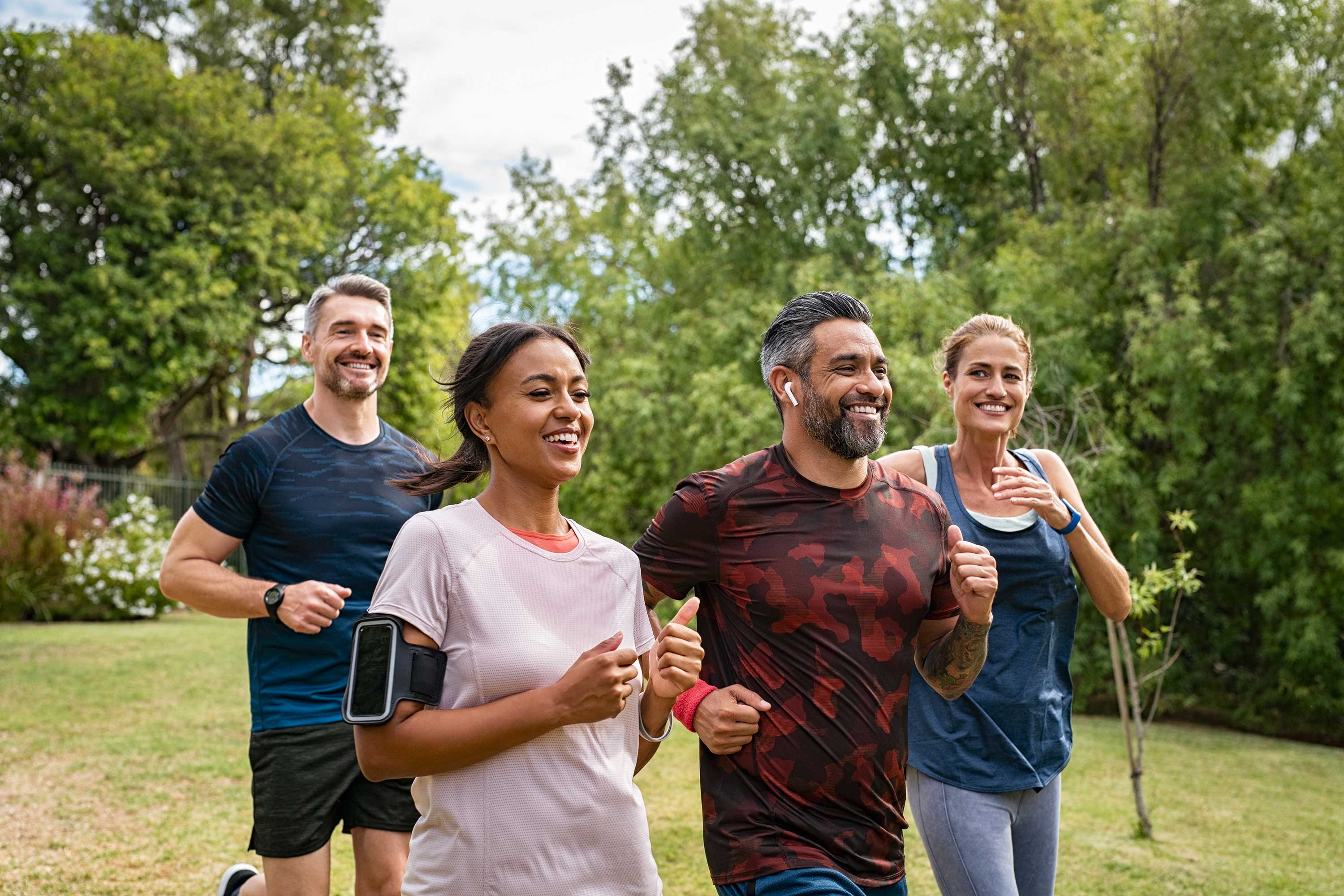 Stock photo  Group of people jogging in park together v1
